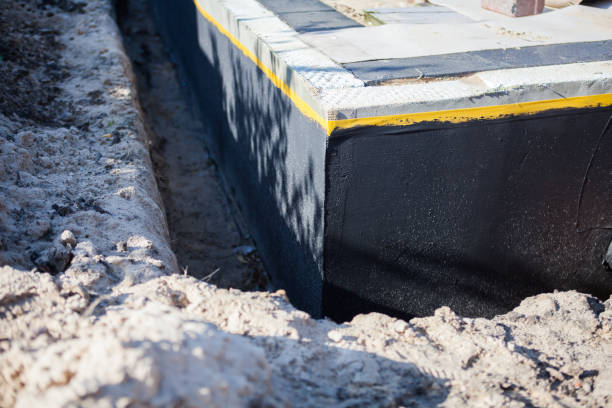 Professional Waterproofing technician working in Hopkins, MN